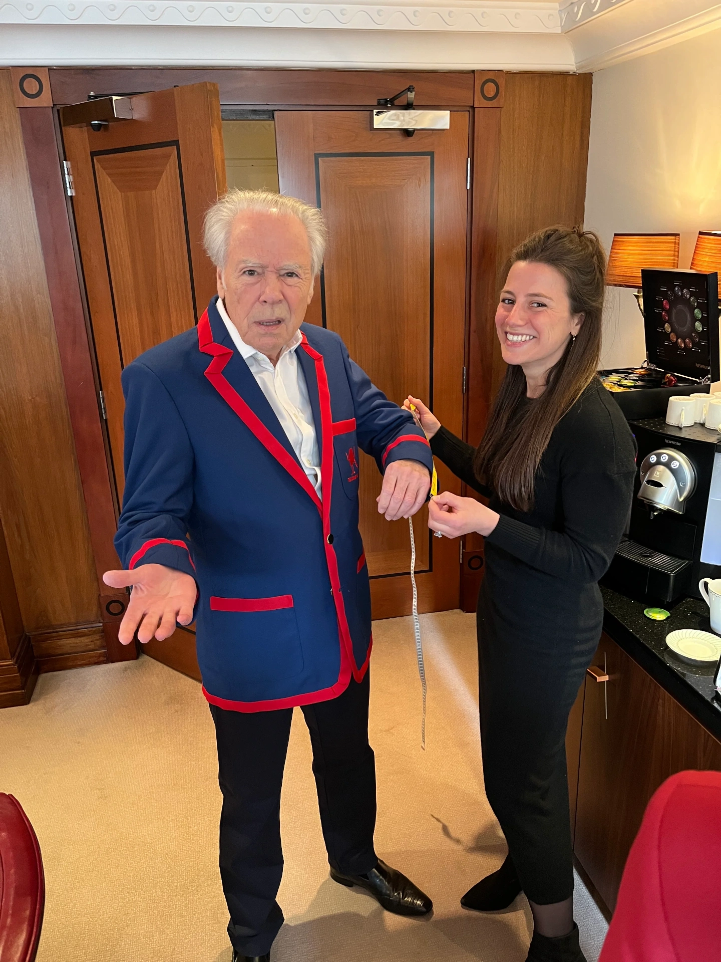 Deborah Cridland fitting Nigel Olsson for a custom blazer