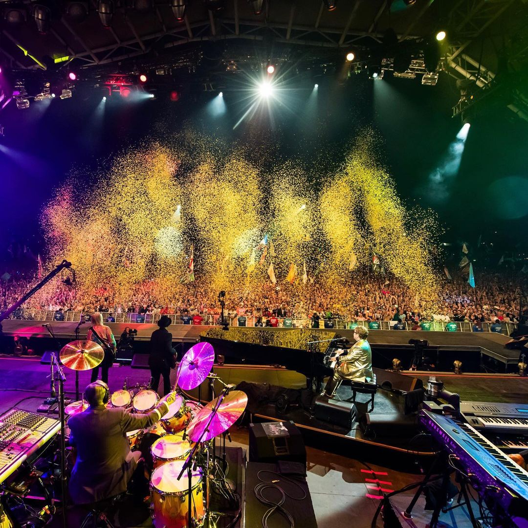 Elton John's band at Glastonbury 2023 with Nigel Olsson in Tom Cridland purple suit